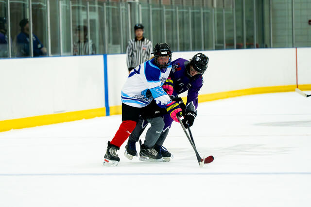 Teammates talk during a stoppage